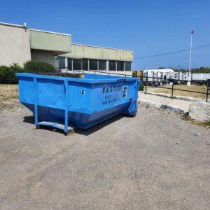 Eastco Hauling 10 yard roll-off bin on a gravel lot