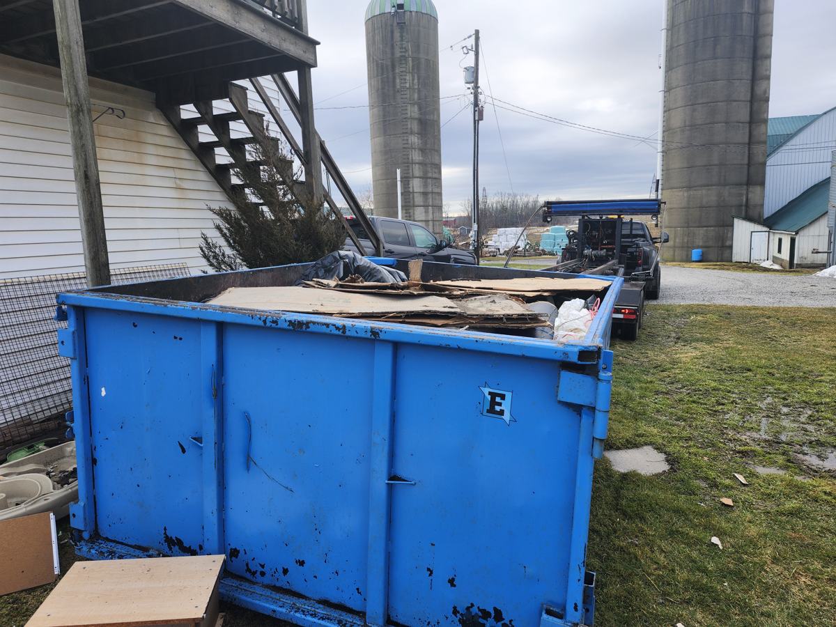 Eastco Hauling 40 yard roll-off bin on a job site